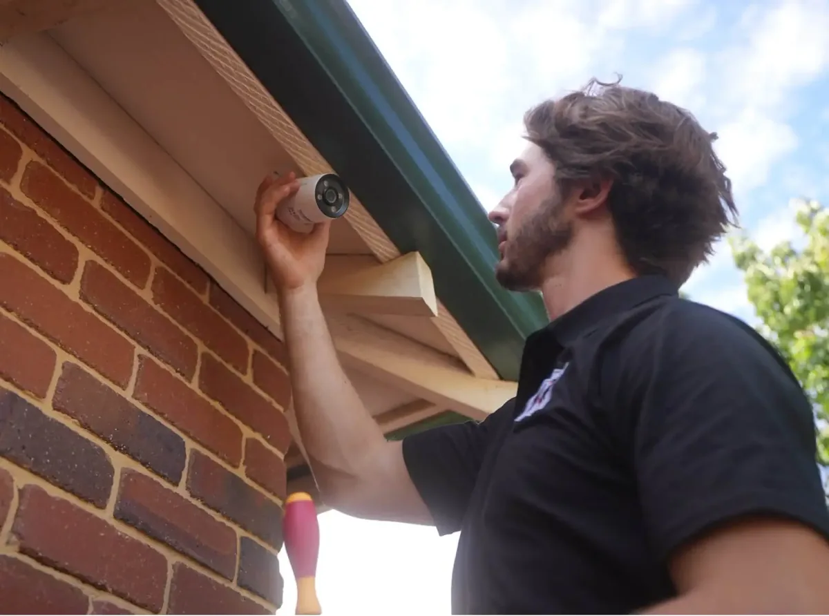 CCTV camera mounted under home eave